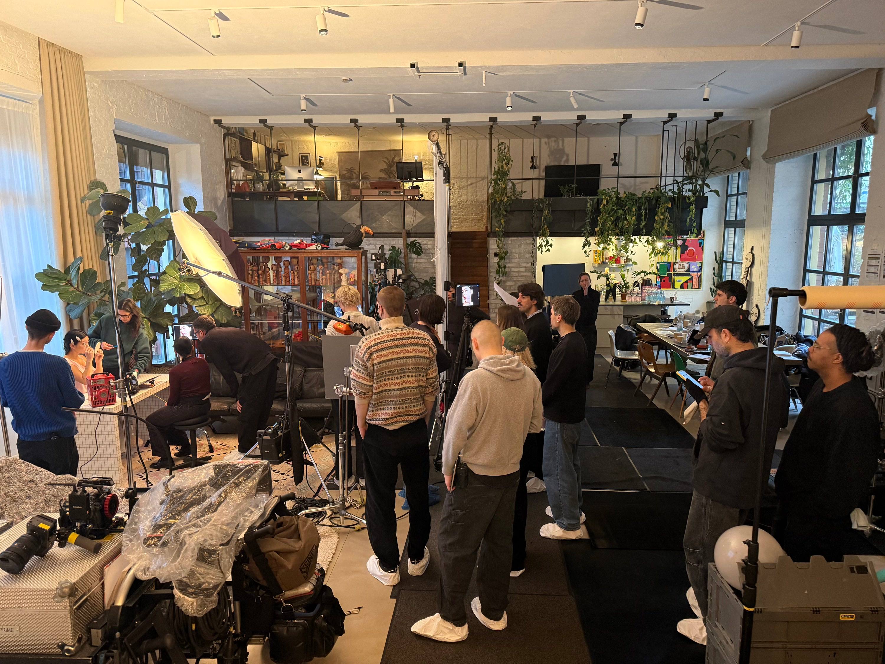 Crew, lights and monitors on a campaign set in a Berlin loft