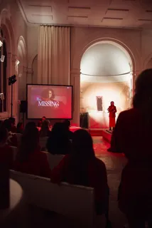 Screening in the hall, guests in front of the screen